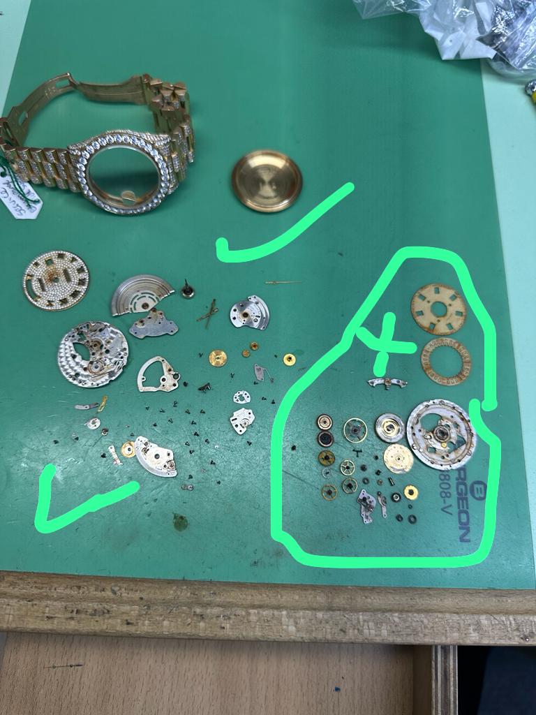 Rolex brought in for a service. Parts circled are all the ones which has to be replaced due to water damage